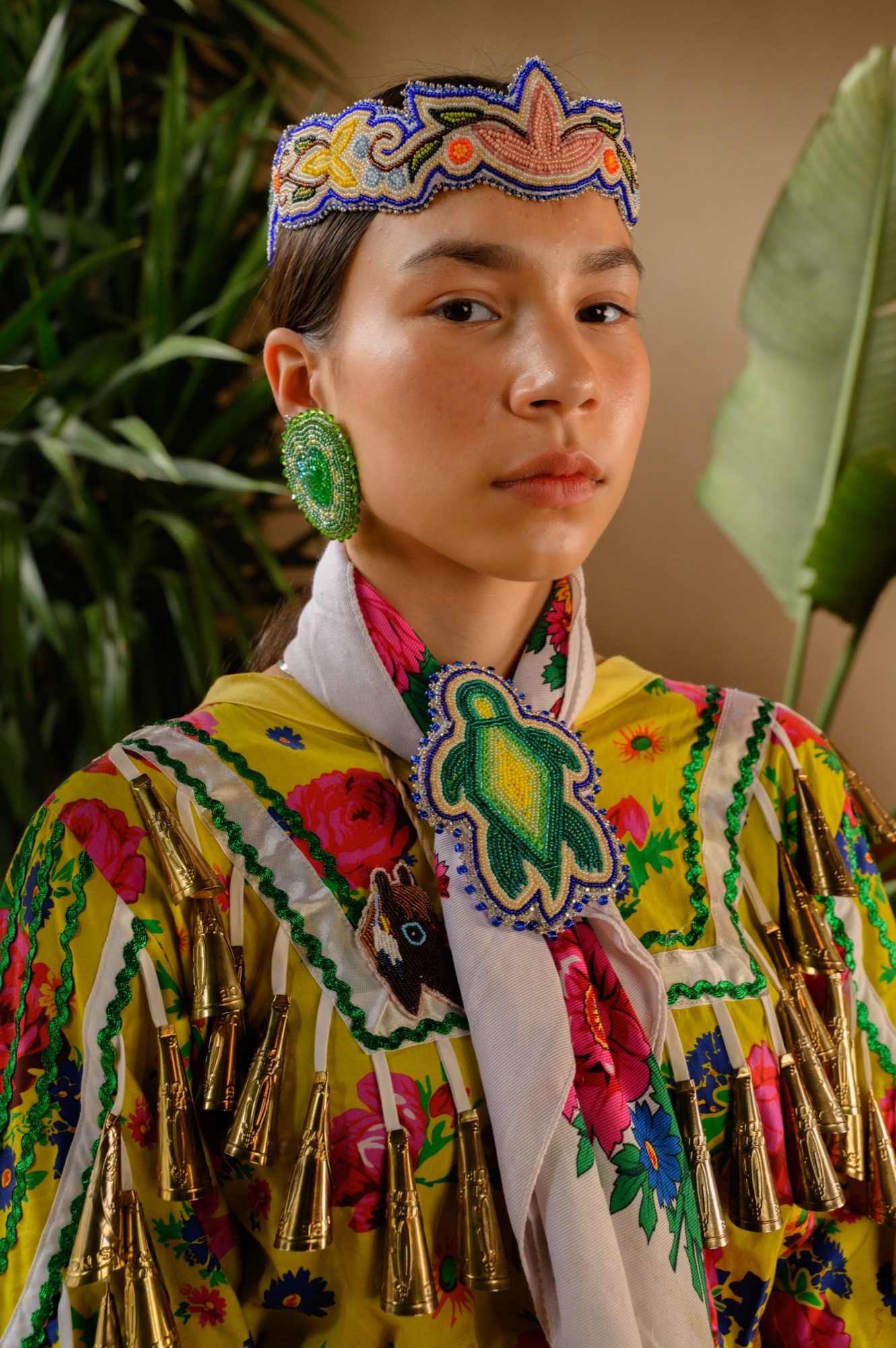 Close portrait of Valerie Leith in jingle dress regalia with turtle beadwork