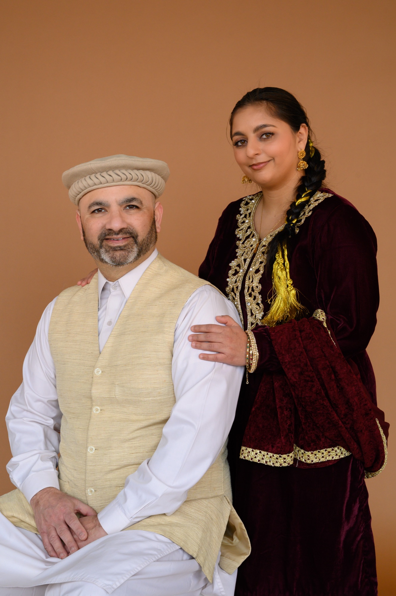 Aliza Mashadi with a family member, both in traditional dress